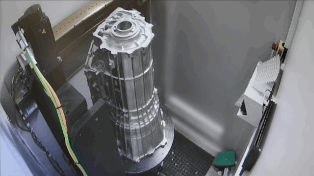 A 10-speed transmission casing rotates inside the CT scanner, evaluating the part three-dimensionally